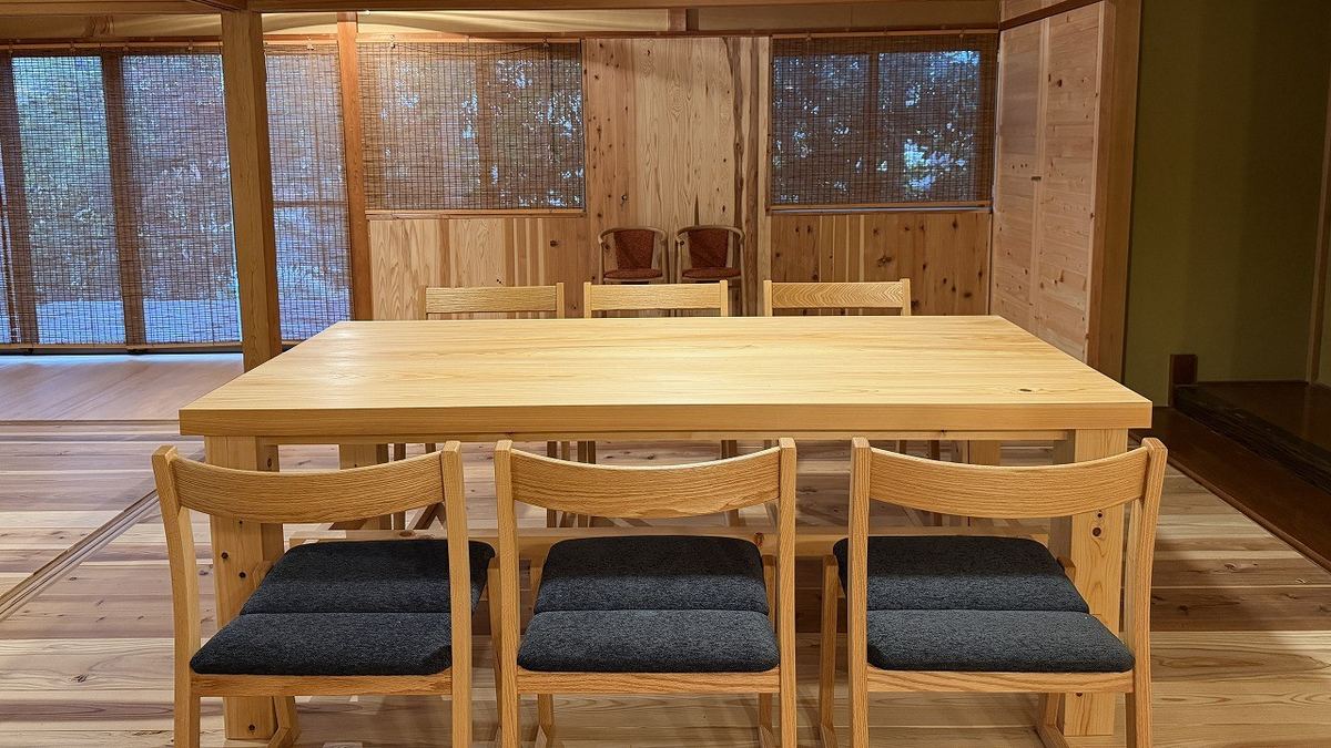 The solid-wood dining table and chairs